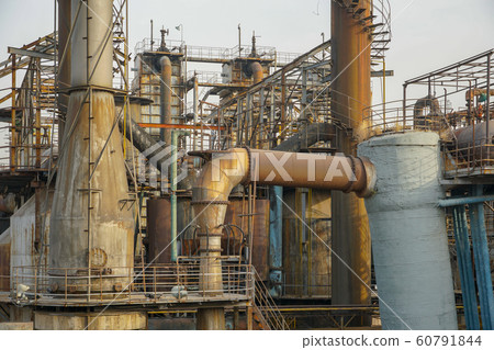 ndustrial plant with old rusty pipes and cooling tower ndustrial plant with old rusty pipes and cooling tower 60791844