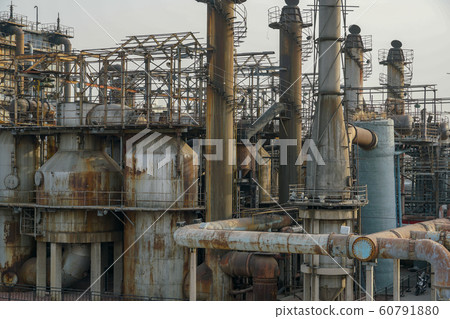 ndustrial plant with old rusty pipes and cooling tower 60791880