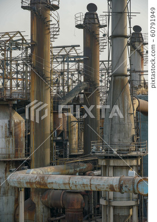 ndustrial plant with old rusty pipes and cooling tower ndustrial plant with old rusty pipes and cooling tower 60791949