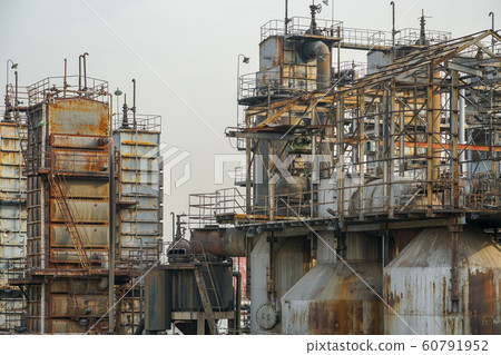 ndustrial plant with old rusty pipes and cooling tower ndustrial plant with old rusty pipes and cooling tower 60791952