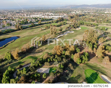 Aerial view oveAerial view over golf fieldr golf field Aerial view oveAerial view over golf fieldr golf field 60792146