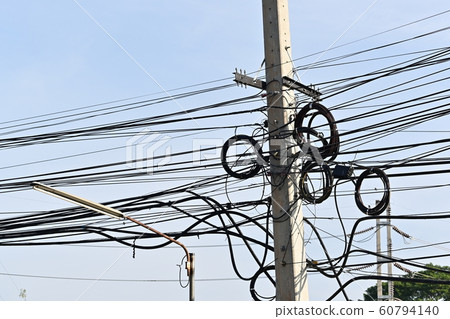 tangle cable wire on electricity pole 60794140