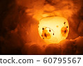 Candle light in ice and snow on Christmas day 60795567
