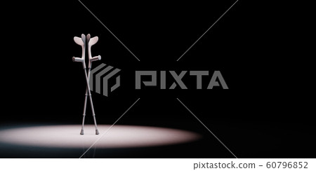 Crutches Spotlighted on Black Background 60796852