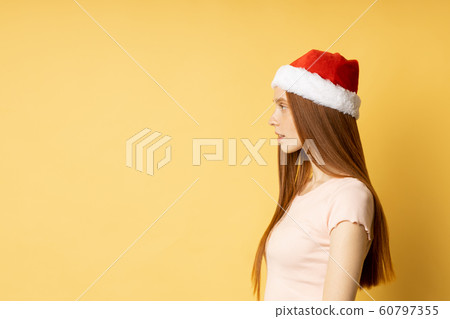Beautiful caucasian female model wearing santa hat Beautiful caucasian female model wearing santa hat 60797355