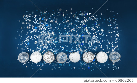 Christmas white baubles collection on blue glitter Christmas white baubles collection on blue glitter 60802205
