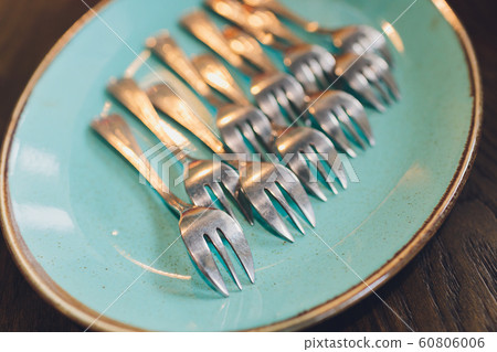 spoons, chopsticks, and plates set in buffet. spoons, chopsticks, and plates set in buffet. 60806006