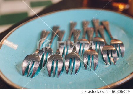 spoons, chopsticks, and plates set in buffet. spoons, chopsticks, and plates set in buffet. 60806009