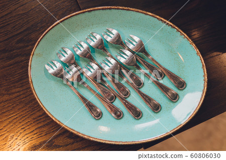 spoons, chopsticks, and plates set in buffet. spoons, chopsticks, and plates set in buffet. 60806030