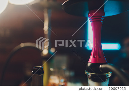 A whole hookah is on the table in the restaurant, smoke, golden mine, dark wood, club, hookah, rest in the lounge bar. A whole hookah is on the table in the restaurant, smoke, golden mine, dark wood, club, hookah, rest in the lounge bar. 60807913