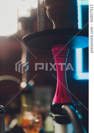 A whole hookah is on the table in the restaurant, smoke, golden mine, dark wood, club, hookah, rest in the lounge bar. A whole hookah is on the table in the restaurant, smoke, golden mine, dark wood, club, hookah, rest in the lounge bar. 60807915