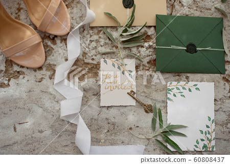 Wedding invitation as a decorated letter in an envelope in the style of boho. Wedding invitation as a decorated letter in an envelope in the style of boho. 60808437