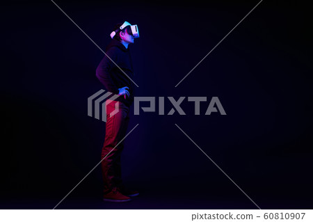 Man wearing virtual reality headset. 60810907