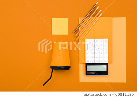 School and office supplies lie neatly on an orange background School and office supplies lie neatly on an orange background 60811180