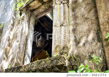 Buddha by window at wat Somdej, Sangkhlaburi Buddha by window at wat Somdej, Sangkhlaburi 60811553
