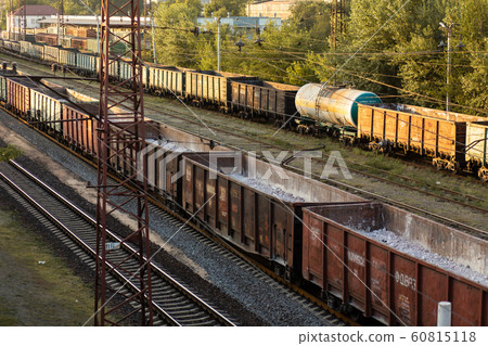 Railway. Freight wagons carrying different loads. 60815118