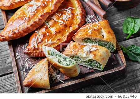 close-up of a calzones wth Spinach and Cheese 60815440
