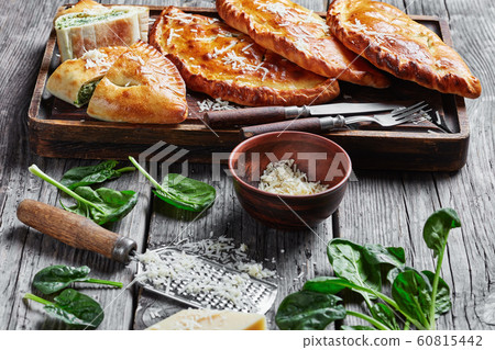close-up of calzones wth Spinach and Cheese close-up of calzones wth Spinach and Cheese 60815442