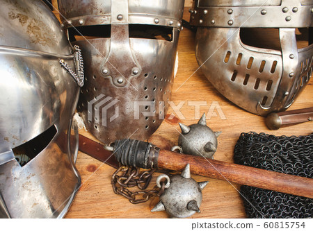 Shiny metal helmets of medieval knights 60815754