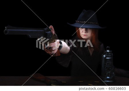 wild west girl shooting from revolver gun  60816603