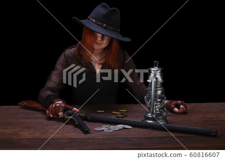 wild west girl shooting from revolver gun wild west girl shooting from revolver gun 60816607