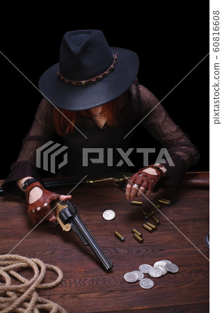 wild west girl shooting from revolver gun wild west girl shooting from revolver gun 60816608