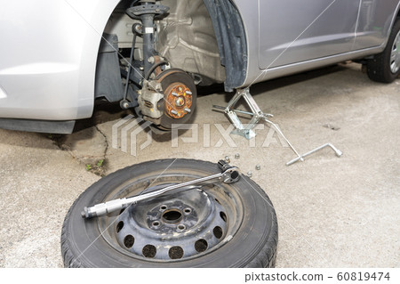 Tire change jack up work scenery 60819474