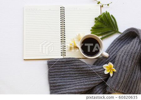notebook planner for business work with hot coffee espresso , flowers and knitting wool scarf of lifestyle woman notebook planner for business work with hot coffee espresso , flowers and knitting wool scarf of lifestyle woman 60820635