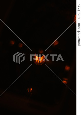 A Reflection of a Light Bulb off of a Wet Screen A Reflection of a Light Bulb off of a Wet Screen 60821639