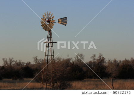 Windmill at Sunset with tree's and Sky. Windmill at Sunset with tree's and Sky. 60822175