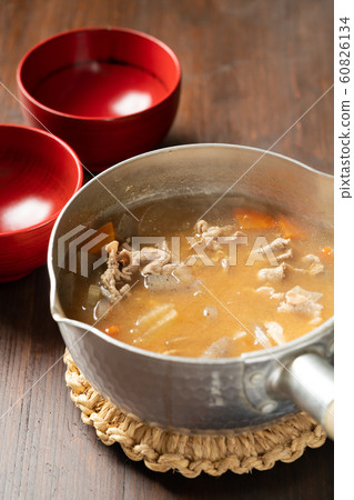 Pork juice in a pot 60826134