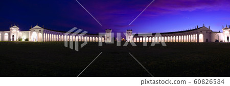 Night view of the majestic and imposing columned facade (Barchessa or barn wing) of Villa Manin, the biggest venetian villa of Italy and residence of the last Doge of Venice. 60826584