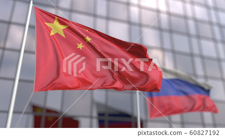 Waving flags of China and Russia in front of a modern skyscraper facade. 3D rendering 60827192
