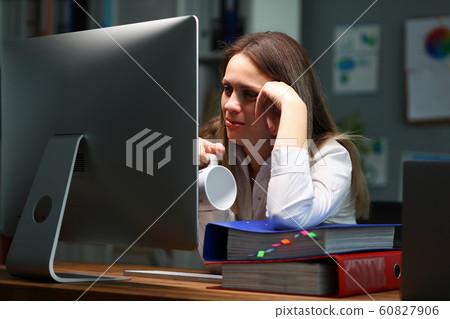 Lady holding cup 60827906