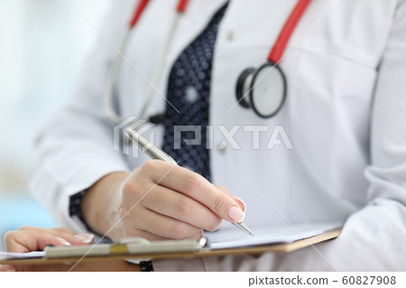 Woman holding silver pen Woman holding silver pen 60827908