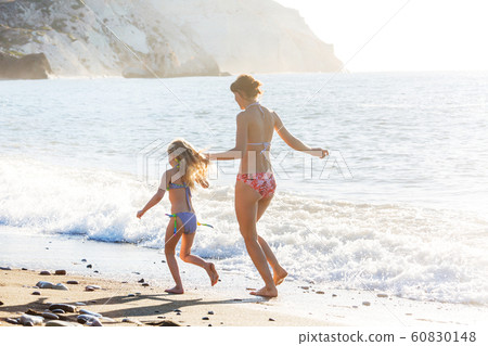 Family on the beach 60830148