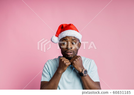 African american man wearing Santa hat 60831185