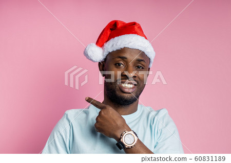 African american man wearing Santa hat 60831189