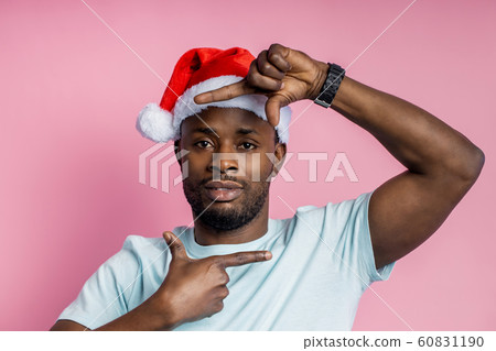 African american man wearing Santa hat 60831190