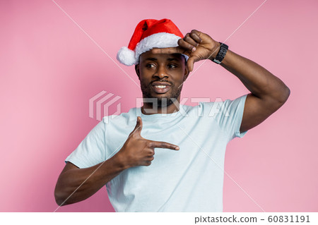African american man wearing Santa hat 60831191