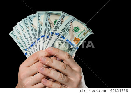 Close up of a businessman's hands holding money Close up of a businessman's hands holding money 60831788