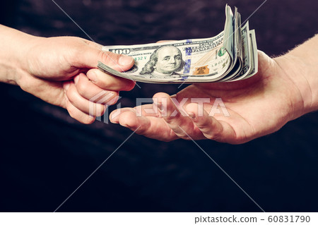 Close up of a businessman's hands holding money Close up of a businessman's hands holding money 60831790