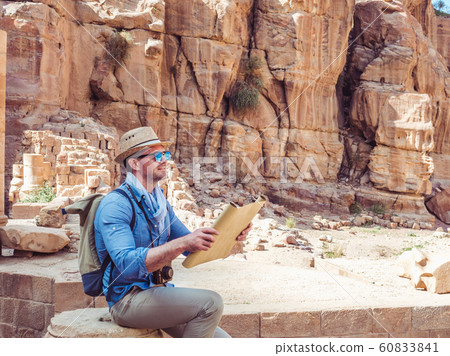 Handsome man, exploring the sights of of Petra Handsome man, exploring the sights of of Petra 60833841