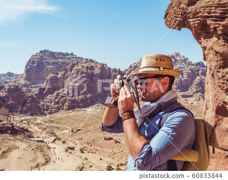 Tourist with a vintage camera. Petra, Jordan. Tourist with a vintage camera. Petra, Jordan. 60833844