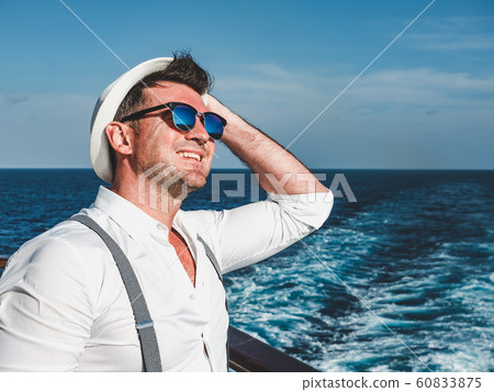 Smiling man on the empty deck of a liner 60833875