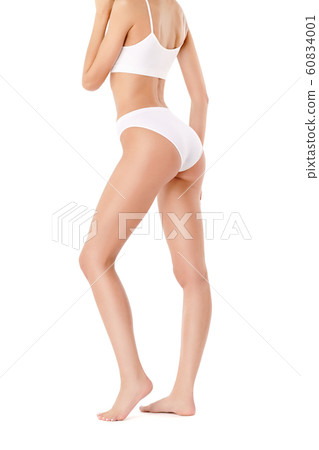 Slim woman's legs isolated on white background Slim woman's legs isolated on white background 60834001