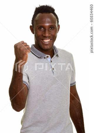 Young happy African man smiling and looking motivated 60834460