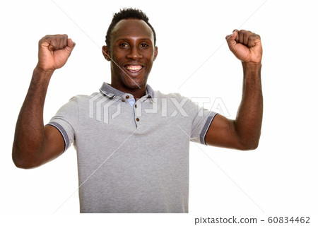 Young happy black African man smiling and looking excited 60834462