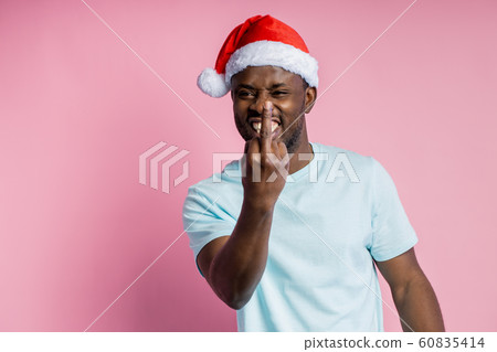 African american man wearing Santa hat 60835414