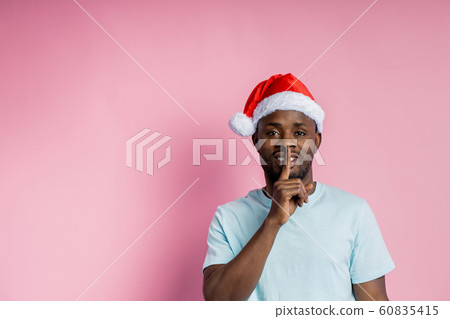 African american man wearing Santa hat 60835415